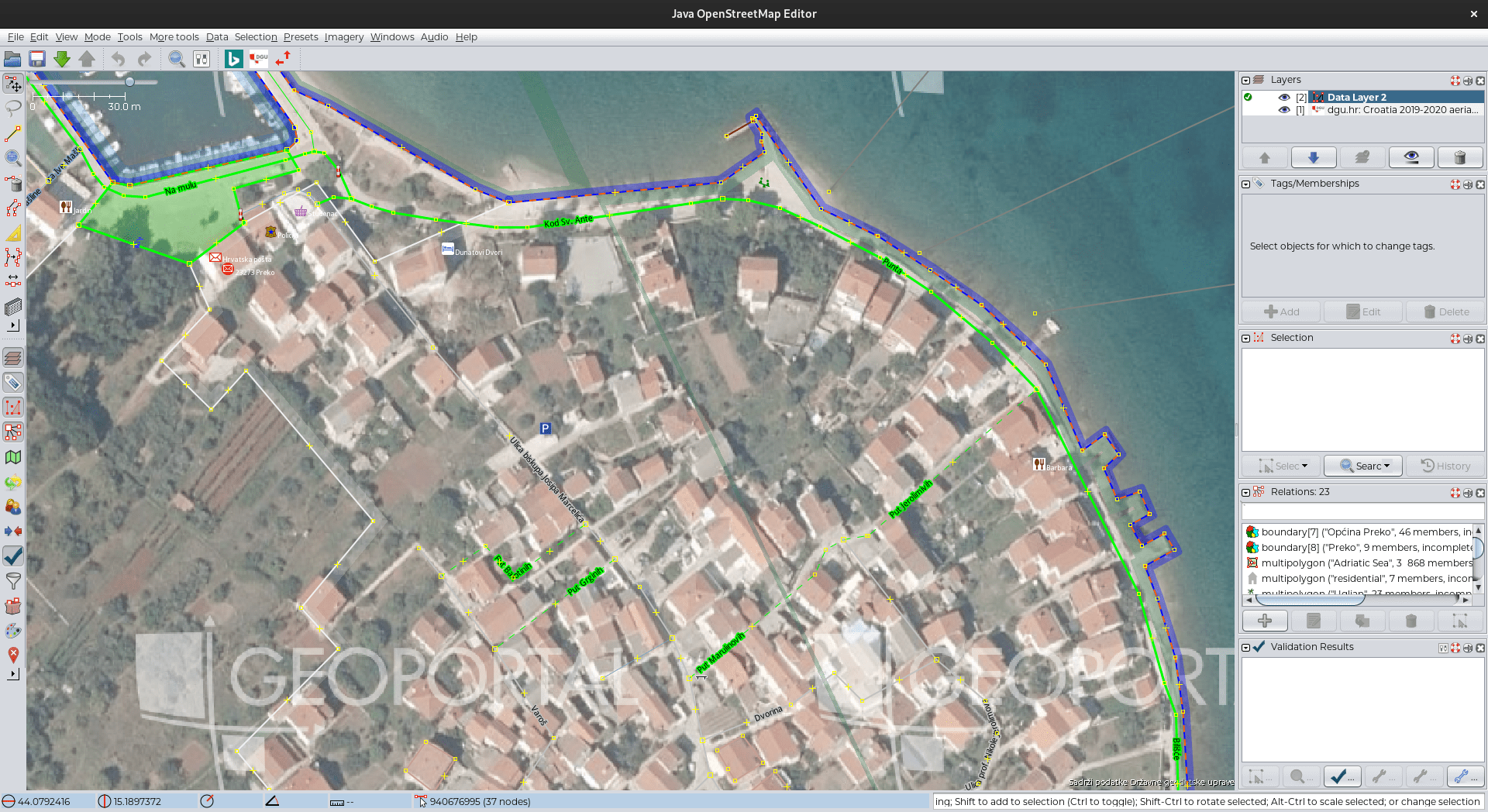 OSM data in JOSM depicting the lack of buildings mapped although the aerial imagery shows otherwise in Preko