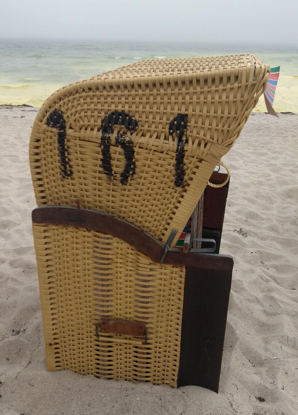 Foto of a #161 numbered beach chair at the shore of the baltic sea in Eckernförde/Germany