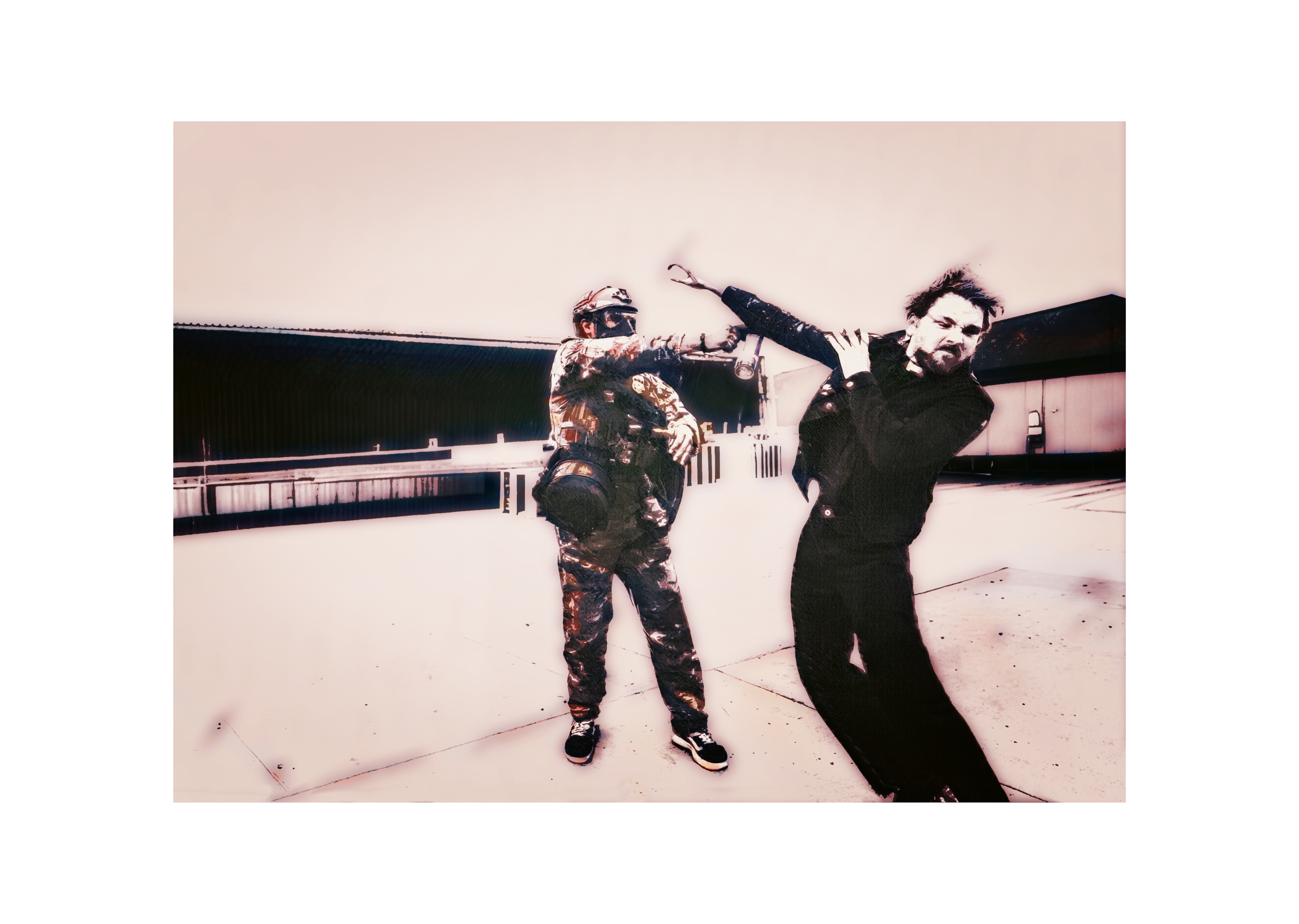 Picture of a masked, armed man pepper spraying a pastor protecting his community. 
(ASHLEE REZIN | PHOTOJOURNALIST, http://www.ashleerezin.com)