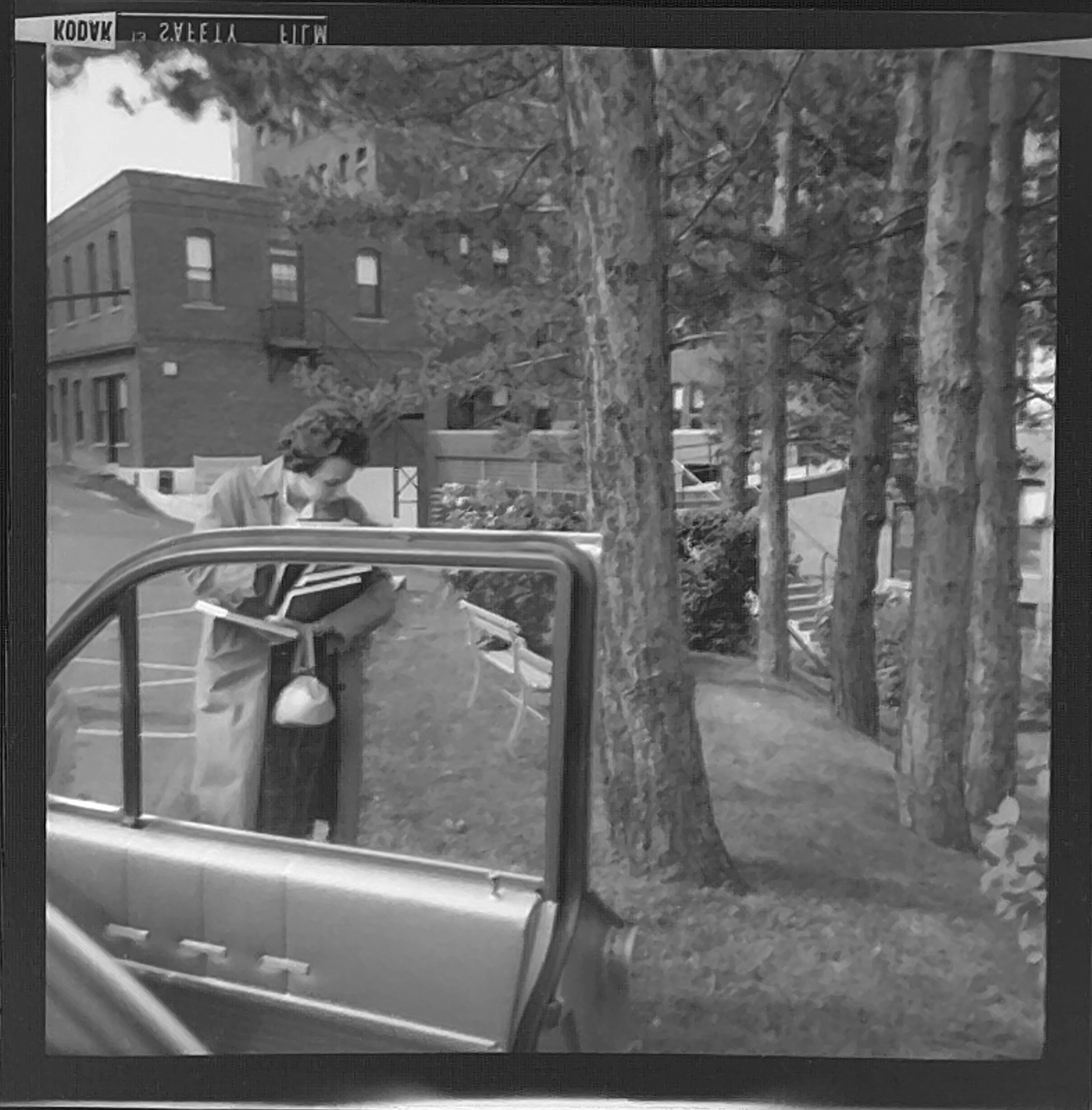 Black and white shot of a young woman standing behind an open car door. She's holding a lot of books, and it looks like there are some college buildings in the background. It looks like she's got slightly more books than she can easily carry.